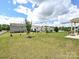 Expansive backyard featuring lush green grass and ample space for outdoor activities and relaxation at 9027 Gray Willow Rd, Charlotte, NC 28227