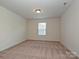Carpeted bedroom with a single window that allows lots of natural light at 9027 Gray Willow Rd, Charlotte, NC 28227