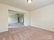 Carpeted bedroom with a view into an en-suite bathroom at 9027 Gray Willow Rd, Charlotte, NC 28227