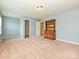 Bright bedroom with carpet, blue walls, and a view into the closet and ensuite bathroom at 9027 Gray Willow Rd, Charlotte, NC 28227