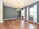 Open dining area with hardwood floors, neutral walls, and natural light at 9027 Gray Willow Rd, Charlotte, NC 28227