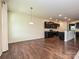 Dining room with wood floors leading to kitchen, offering ample space for entertaining and Gathering meals at 9027 Gray Willow Rd, Charlotte, NC 28227