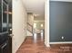 Foyer with hardwood floors, stairs and a view into the living area at 9027 Gray Willow Rd, Charlotte, NC 28227