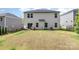 A spacious backyard with a small patio area and an egg chair, perfect for outdoor relaxation and entertaining at 941 Rachel Anne Dr, Belmont, NC 28012