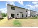 A well-maintained backyard with a patio and a modern hanging chair, ideal for enjoying outdoor living and entertaining at 941 Rachel Anne Dr, Belmont, NC 28012