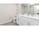 Bathroom featuring double sinks, white cabinets, and a toilet at 941 Rachel Anne Dr, Belmont, NC 28012