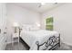 Bright bedroom showcasing a ceiling fan, plush carpet, and a large window that provides lots of natural light at 941 Rachel Anne Dr, Belmont, NC 28012