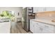 Bright kitchen features stainless steel appliances, white cabinets, and adjacent dining area with natural light at 941 Rachel Anne Dr, Belmont, NC 28012