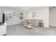 Well-lit living room with a large sectional couch and a glass coffee table at 941 Rachel Anne Dr, Belmont, NC 28012