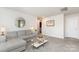 Comfortable living room with a sectional sofa, glass coffee table, and contemporary decor at 941 Rachel Anne Dr, Belmont, NC 28012