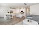 Open living space with dining area, kitchen island, stainless appliances, and modern furnishings at 941 Rachel Anne Dr, Belmont, NC 28012