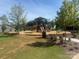 Community playground with play structure, slides, and lawn area at 941 Rachel Anne Dr, Belmont, NC 28012