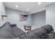 Finished basement with sectional sofa, accent table, and recessed lighting at 9775 Mallard Glen Dr, Charlotte, NC 28262