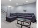 Finished basement with sectional sofa, accent table, and carpet at 9775 Mallard Glen Dr, Charlotte, NC 28262