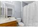 Cozy bathroom with a vanity and shower-tub combo offers a functional and inviting space at 9775 Mallard Glen Dr, Charlotte, NC 28262