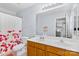 Well-lit bathroom with double sinks and a shower/tub combo offers convenience and style at 9775 Mallard Glen Dr, Charlotte, NC 28262