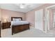 Cozy bedroom offers a peaceful retreat with soft lighting and neutral color palette at 9775 Mallard Glen Dr, Charlotte, NC 28262