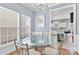 Bright dining area with glass table and modern chandelier at 9775 Mallard Glen Dr, Charlotte, NC 28262