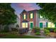 Charming brick townhome with green door and shutters, manicured landscaping at 9775 Mallard Glen Dr, Charlotte, NC 28262