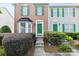 Inviting brick townhome with green door and well-kept front garden at 9775 Mallard Glen Dr, Charlotte, NC 28262
