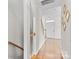 Inviting hallway with hardwood floors and natural light leads to the front door, offering a warm welcome at 9775 Mallard Glen Dr, Charlotte, NC 28262