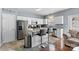 Updated kitchen boasting stainless steel appliances, a breakfast bar, and seamless living area access at 9775 Mallard Glen Dr, Charlotte, NC 28262