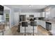 Bright kitchen featuring a breakfast bar, ample counter space, and modern appliances at 9775 Mallard Glen Dr, Charlotte, NC 28262