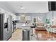 Modern kitchen with stainless steel appliances, granite countertops, and a breakfast bar at 9775 Mallard Glen Dr, Charlotte, NC 28262