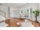 Open living area with bright bay windows and neutral color palette at 9775 Mallard Glen Dr, Charlotte, NC 28262