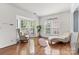 Sunlit living room featuring hardwood floors and comfortable seating at 9775 Mallard Glen Dr, Charlotte, NC 28262