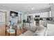 Open-concept living space with kitchen view, breakfast bar and comfortable seating at 9775 Mallard Glen Dr, Charlotte, NC 28262