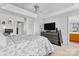 Main bedroom featuring a ceiling fan, ensuite bathroom, and ample space for relaxing at 9775 Mallard Glen Dr, Charlotte, NC 28262