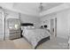 Large primary bedroom with a ceiling fan and neutral tones offers a peaceful retreat at 9775 Mallard Glen Dr, Charlotte, NC 28262