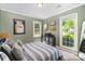 Bright bedroom with two windows, striped bedding and gray walls at 1014 Covewood Ct, Charlotte, NC 28270