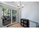 Dining area with sliding glass doors that open to a deck with patio furniture at 1014 Covewood Ct, Charlotte, NC 28270