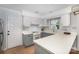 Bright kitchen with ample counter space, white cabinets, and stainless steel appliances at 1014 Covewood Ct, Charlotte, NC 28270