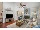 Cozy living room features a vaulted ceiling, painted fireplace, and comfortable seating at 1014 Covewood Ct, Charlotte, NC 28270