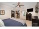 Comfortable main bedroom with closet and mounted TV at 1014 Covewood Ct, Charlotte, NC 28270