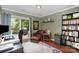 Comfortable home office with a view of the backyard and custom built-in bookshelves at 1014 Covewood Ct, Charlotte, NC 28270