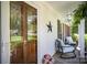 Inviting front porch with rocking chairs and decorative door with sidelights at 1014 Covewood Ct, Charlotte, NC 28270