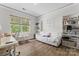 Bright bedroom features hardwood floors, a large window, and built-in bookshelves for a relaxing retreat at 1016 Spanish Moss Rd, Indian Trail, NC 28079