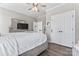Comfortable bedroom with a cozy bed, and ample closet space with hardwood floors and neutral decor at 1016 Spanish Moss Rd, Indian Trail, NC 28079