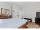Bedroom showcasing wooden flooring, a wood framed dresser, and a comfortable bed at 1016 Spanish Moss Rd, Indian Trail, NC 28079