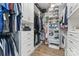 Spacious walk-in closet with custom shelving, drawers, and racks for optimal organization and storage at 1016 Spanish Moss Rd, Indian Trail, NC 28079