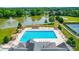 Lovely community pool area, surrounded by trees, a pond, tennis courts and cabanas at 1016 Spanish Moss Rd, Indian Trail, NC 28079