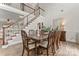 Elegant dining room with a large table, stylish chairs, and a staircase nearby at 1016 Spanish Moss Rd, Indian Trail, NC 28079