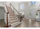 Bright entryway boasts high ceilings and a grand staircase leading to the upper level at 1016 Spanish Moss Rd, Indian Trail, NC 28079