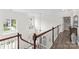 Bright foyer with hardwood floors, beautiful staircase, and natural light from windows overlooking the front yard at 1016 Spanish Moss Rd, Indian Trail, NC 28079