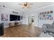 Spacious living room with modern decor, entertainment center, and hardwood floors at 1016 Spanish Moss Rd, Indian Trail, NC 28079