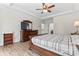 Spacious main bedroom with wood floors, ceiling fan, tray ceilings and connecting bath at 1016 Spanish Moss Rd, Indian Trail, NC 28079